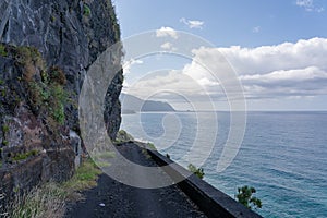 Dangerous part of the old road with rockfall