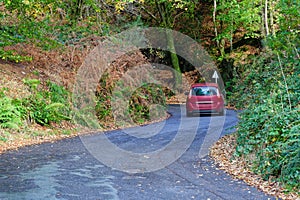 Dangerous road bend in rural countryside in autumn