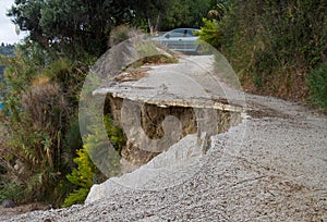 Undermined road after landslide photo