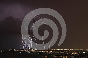 Dangerous storm of lightning and lightning in the clouds that touch the ground