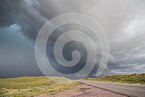 A dangerous thunderstorm approaches a rural highway in Nebraska.