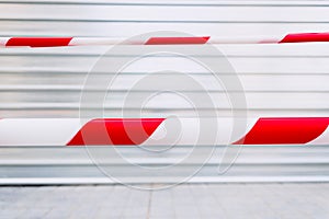 Dangerous zone, closed and delimited with barrier tape, defocused background