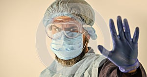 Dangerous zone. Stop. Personal protective equipment. Man wearing protective mask. Coronavirus pandemic. Garments protect