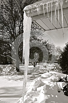 Dangerously huge icicle hanging from an eavestrough
