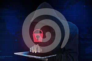 The dangers of identity theft,hacker wearing black hoodie,hacking computer program security