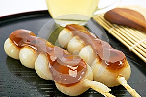 Dango Japanese dessert, served with tea.