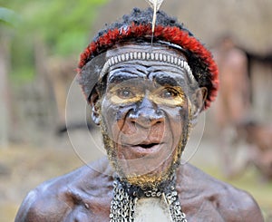 DANI VILLAGE, WAMENA, IRIAN JAYA, NEW GUINEA, INDONESIA, 15 MAY 2016: Close up Portrait of Yali Mabel, the chief of Dani tribe. Du