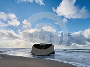 Danish beach section, with bunkers that are slowly being swallowed up by the sea.