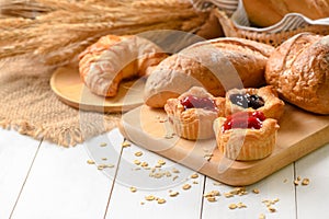 Danish bread with fruits, blueberry and cherry sauce