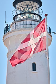 Danish Dannebrog in front of Hirtshals lighthouse photo