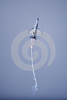 The Danish F-16 Fighting Falcon in high speed action dropping fl