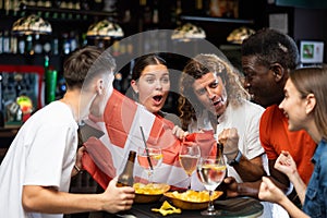 Danish fans scream with joy in beer bar. Denmark win