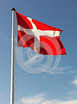 Danish flag on blue sky photo