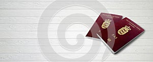 Danish Passports on Wood Lines Background Banner with Copy Space - 3D Illustration