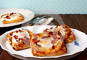 Danish pastries, breakfast with egg, bacon, cheese and puff pastries