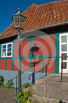 Danish townhouse with street lantern and its shadow