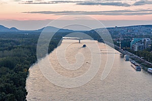 Danube river and Bratislava cityscape at sunset, Slovakia.