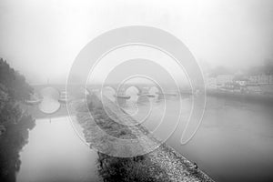 Danube river bridge in fog in Regensburg, Germany