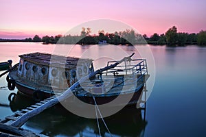 Danube River. Colored sunset landscape in natural reserve of the Danube Delta - landmark attraction in Romania