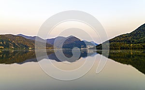 The Danube river at sunset with the reflection of the hills in the water wallpaper
