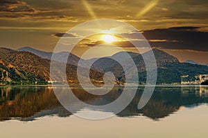 The Danube river at sunset and a spectacular sky with the reflection of the hills in the water wallpaper