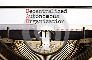 DAO decentralized autonomous organization symbol. Concept words DAO decentralized autonomous organization typed on old retro