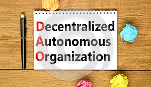 DAO decentralized autonomous organization symbol. Concept words DAO decentralized autonomous organization on white note on a