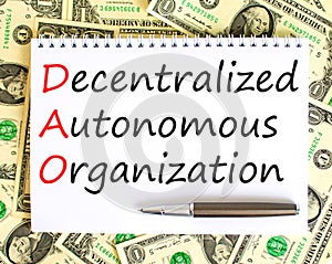 DAO decentralized autonomous organization symbol. Concept words DAO decentralized autonomous organization on white note on a
