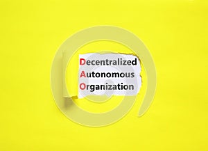 DAO decentralized autonomous organization symbol. Concept words DAO decentralized autonomous organization on white paper on a