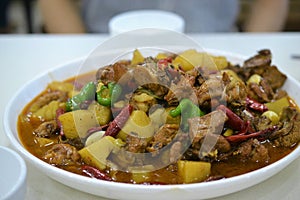 Dapanji, Chinese chicken dish, Chinese food, Xinjiang Uyghur delicacies at Kashgar night market photo