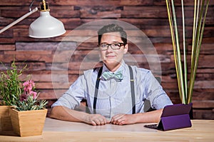 Dapper Woman in Hipster Office with Tablet photo