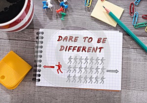 Dare to be different concept on a notepad