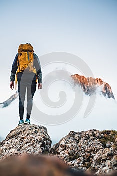 Daring climber conquering the jagged mountainous heights of the Dolomites, part of the Alps in Italy