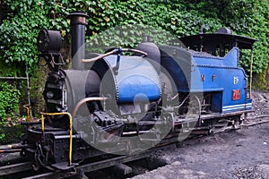 DARJEELING, INDIAN -June 22, The toy train of Darjeeling Himalayan Railway runs on the track in Darjeeling, India. Darjeeling