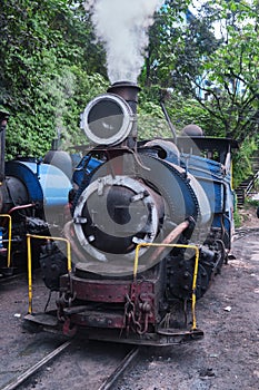 DARJEELING, INDIAN -June 22, The toy train of Darjeeling Himalayan Railway runs on the track in Darjeeling, India. Darjeeling