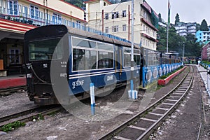 DARJEELING, INDIAN -June 22, The toy train of Darjeeling Himalayan Railway runs on the track in Darjeeling, India. Darjeeling