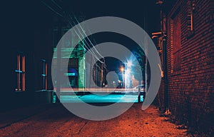 Dark alley and light trails in Hanover, Pennsylvania at night.