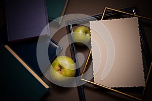 Dark background with books and frames