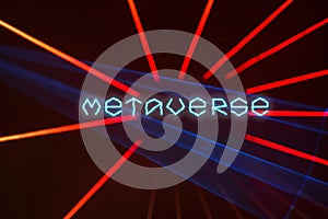 Dark background with red laser beams and text Metavese.