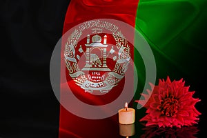 picture of the Afganistan flag and candles photo