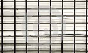 dark bars on a background of gray galvanized sheet, the intersection the horizontal and vertical.