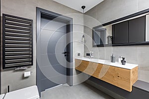 Dark bathroom with countertop basin