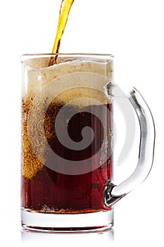 Dark beer pouring into glass