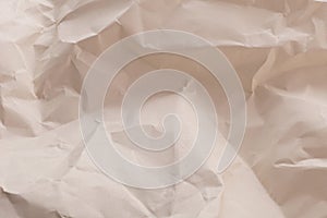 Dark beige crumpled paper with soft texture background