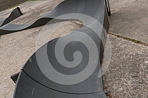 Dark black carbon plastic bikepark bike pump track park skatepark ramp tube pre precast modular composite pumptrack fab