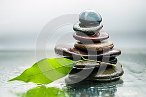 Dark or black rocks on water, background for spa, relax or wellness therapy