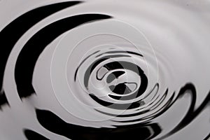 dark black transparent water wave surface with splash bubble on black water