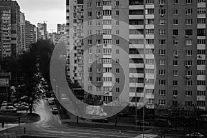 Dark black white cityscape. High-rise building. Facade of panel buildings houses