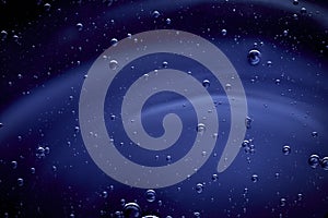 Dark blue abstract background with small bubbles