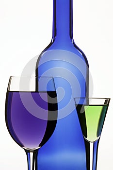 Dark blue bottle and two wine-glasses